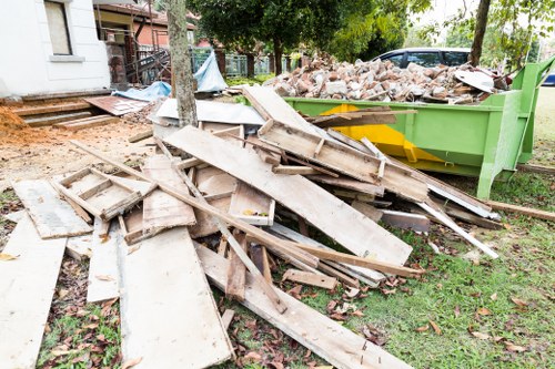 Professional team assessing outdoor space for garden clearance in Tower Hamlets.