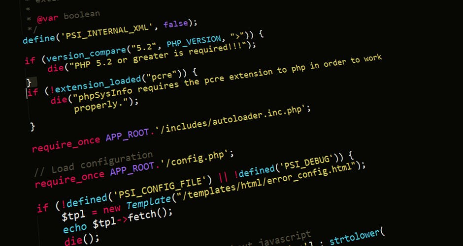 Close-up image of a computer screen displaying lines of code in a text editor with a dark background and colorful syntax highlighting. The code includes keywords, strings, and symbols in blue, green,