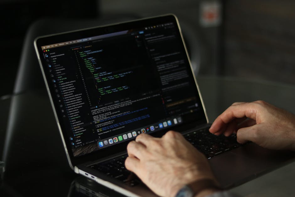 A computer screen displaying lines of code in a variety of colors, including blue, yellow, green, purple, and white, against a dark background. The code is formatted with indentation and includes CSS 